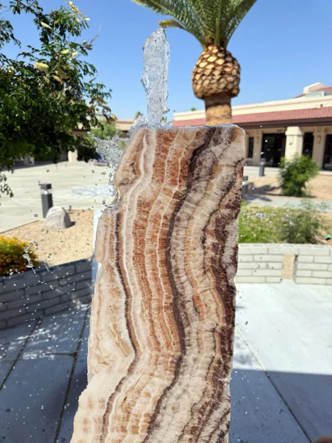 Veined onyx fountain in an outdoor courtyard