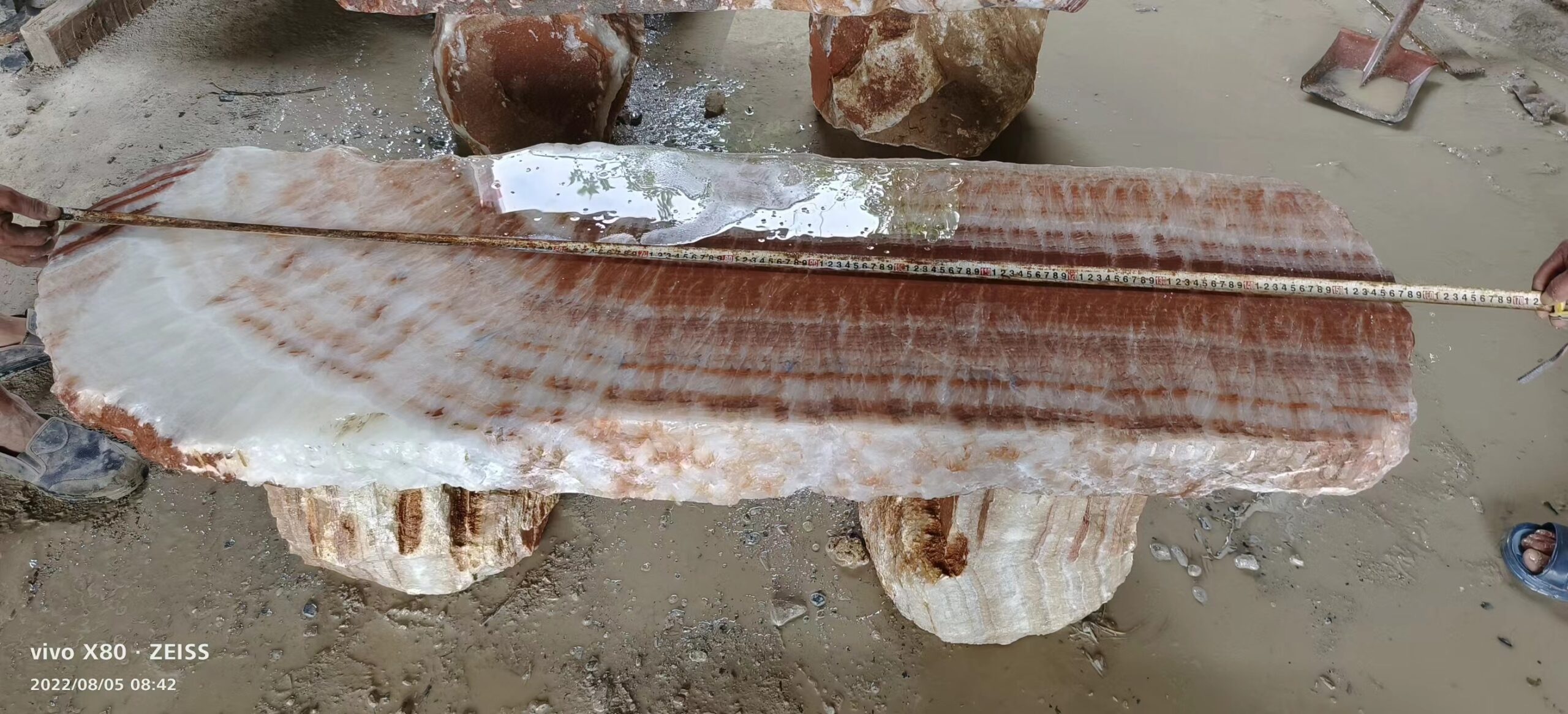 Stone bench with flowing natural bands