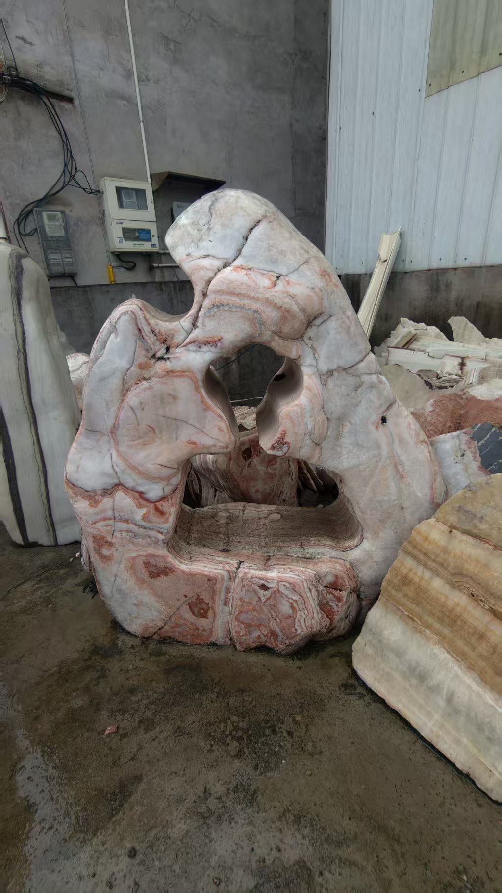 Pale sculptural stone with natural openings