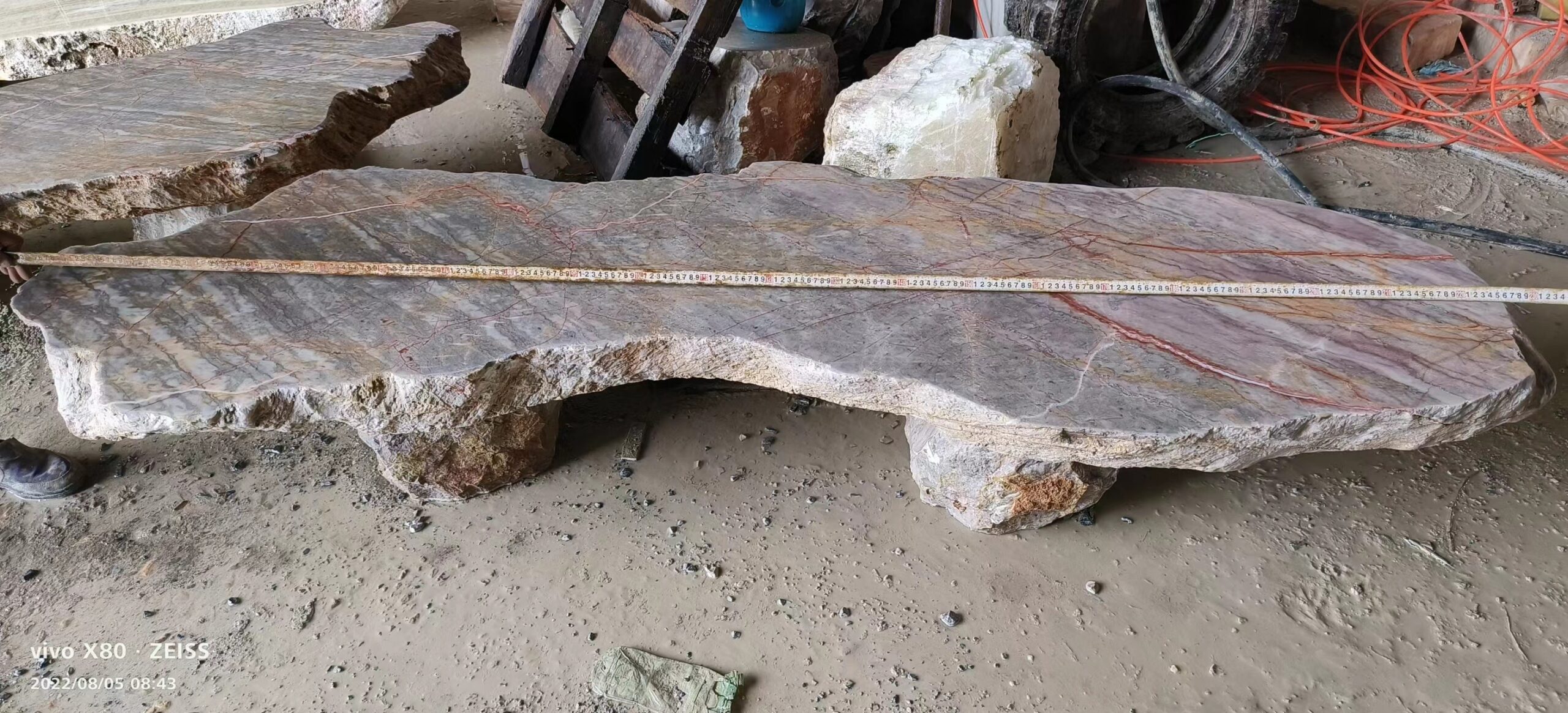 Dark-toned bench with a sculpted edge